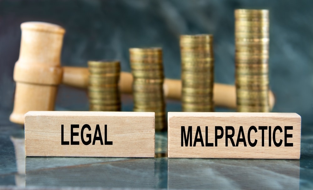 LegalMalpractice-WordOnAWoodenBlockOnA