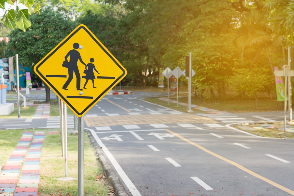 StudentsCrossingAheadSign