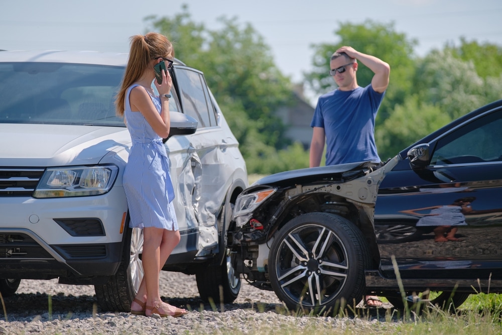 DriversOfSmashedVehiclesArguingWhoIsGuiltyInCar