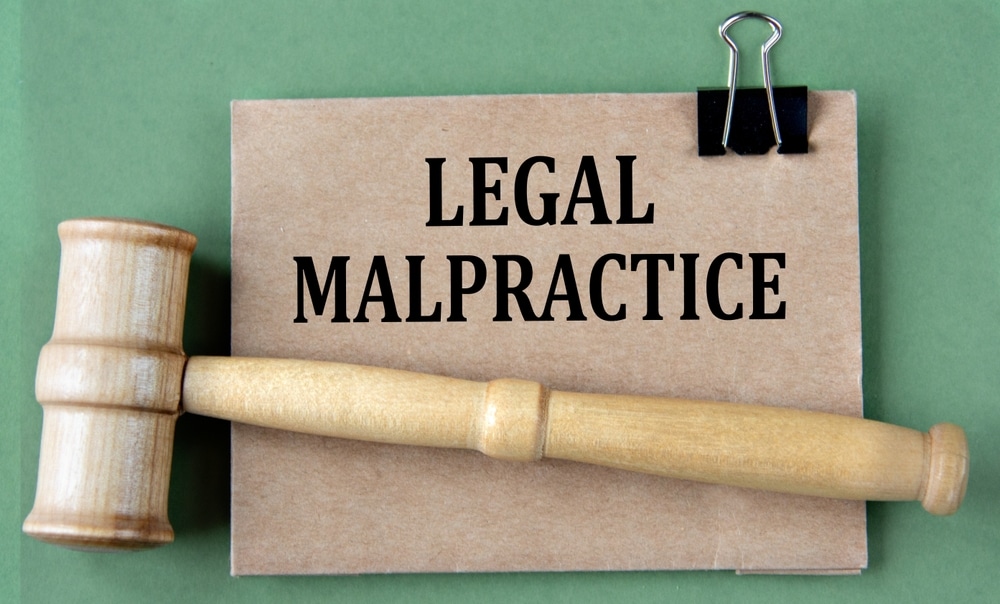 LegalMalpractice-WordsOnBrownPaperOnAGreen