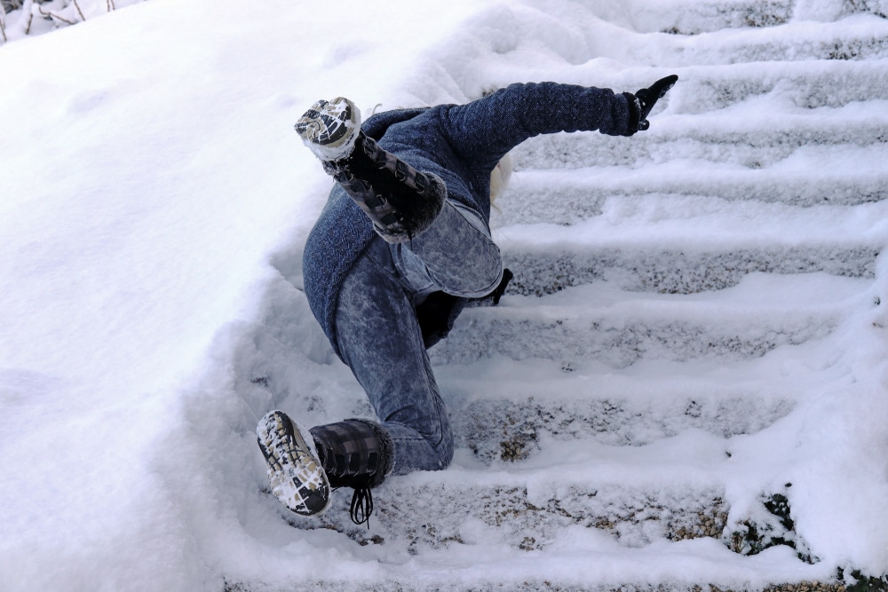AWomanSlippedAndFellOnAWintryStaircaseFall