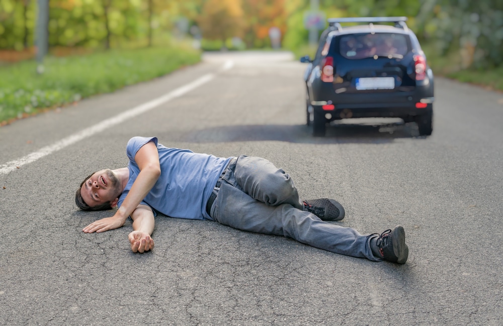 HitAndRunConceptInjuredManOnRoadInFront