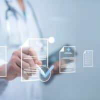 Medical professional reviewing digital medical documentation and records, emphasizing the importance of accurate medical evidence in personal injury claims.